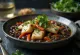 Feijoada cu pește afumat, servită cu coriandru proaspăt