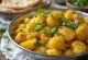 Aloo gobi cu ardei iute, servit cu coriandru proaspăt