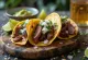 Taco carne asada servit cu lime și coriandru