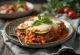 Parmigiana cu dovlecei copți, decorat cu mozzarella și busuioc